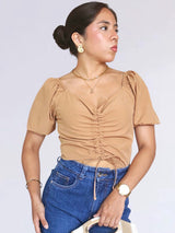 BLUSA CON REGULADOR MANGA CORTA